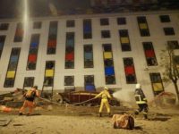 Rescure workers search the damaged Marshal Hotel in Hualien