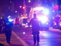 Police and first responders walk down a blocked off road near the site of an alleged bomb explosion on West 23rd Street on September 17, 2016, in New York Police and first responders walk down a blocked off road near the site of an alleged bomb explosion on West 23rd Street on September 17, 2016, in New York