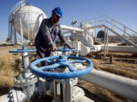 An Iraqi worker checks pipelines at the Bai Hassan oil field on October 19, 2017