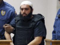 Manhattan Explosion In this Dec. 20, 2016, file photo, Ahmad Khan Rahimi, center, is led into court in Elizabeth, N.J. Rahimi, who set off small bombs on a New York City street and at a charity race in New Jersey, is set to be sentenced to a mandatory term of life in prison. He is scheduled to be sentenced Tuesday, Feb. 13, 2018, by a federal judge in Manhattan. (AP Photo/Mel Evans, File)