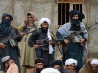 In this Nov. 3, 2015 file photo, Afghan Taliban fighters listen to Mullah Mohammed Rasool, the newly-elected leader of a breakaway faction of the Taliban, in Farah province, Afghanistan. Despite US President Donald Trump’s pronouncement that there would be no talks with the Taliban following a series of deadly attacks in Kabul, officials say talks continue, but neither side trusts the other and neither believes the other negotiates independently.(AP Photo, File)