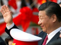 China's President Xi Jinping waves after attending the inauguration ceremony of the Chinese sponsored Vietnam-China Cultural Friendship Palace in Hanoi on November 12, 2017. / AFP PHOTO / POOL / KHAM (Photo credit should read KHAM/AFP/Getty Images)