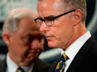 US Attorney General Jeff Sessions (L) looks on as Acting Director of the Federal Bureau of Investigation (FBI) Andrew McCabe (R) speaks during a press conference at the US Department of Justice in Washington, DC, on July 13, 2017. / AFP PHOTO / JIM WATSON (Photo credit should read JIM WATSON/AFP/Getty Images)