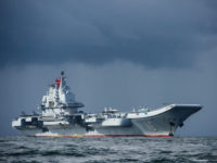 China's sole aircraft carrier, the Liaoning, arrives in Hong Kong waters on July 7, 2017, less than a week after a high-profile visit by Chinese President Xi Jinping. China's sole operational aircraft carrier arrived in Hong Kong for the first time in a display of military might less than a week after a high-profile visit by president Xi Jinping. / AFP PHOTO / ANTHONY WALLACE (Photo credit should read ANTHONY WALLACE/AFP/Getty Images)