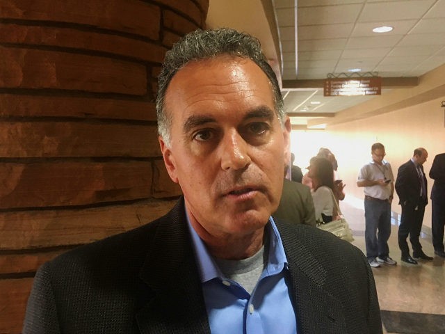 Republican congressional candidate Danny Tarkanian talks with a reporter Friday, March 16, 2018, at the Clark County Government Center in Las Vegas about President Donald Trump asking him to switch from running for U.S. Senate to running for a Congress seat in Nevada. Tarkanian said Trump was "adamant," and said that he plans as a Congressman to be a steadfast supporter of Trump and his policies. (AP Photo/Ken Ritter)