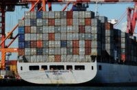 This photo taken on December 16, 2011 shows a container ship sitting berthed in Fremantle Harbour near Perth. Australia's mining-powered economy grew 0.6 percent in the three months to June, slightly below forecasts, and 3.7 percent from a year earlier, weighed by China's slowdown and European woes. Consumer spending was the main driver of quarterly growth, contributing 0.6 percentage points to gross domestic product, with net exports, the value of shipments minus imports, adding 0.3 points. AFP PHOTO / Greg WOOD (Photo credit should read GREG WOOD/AFP/GettyImages)