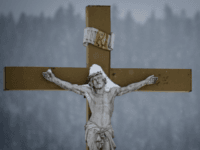 A picture taken on January 17, 2017 shows a snow-covered crucifix outside a church in the city of Mouthe, also dubbed 'Petite Siberie', renowned as the coldest town in France. The cold snap coming from Central Europe is generating temperatures of 5 to 10 degrees below the seasonal average, according to the French meteorological service. / AFP / Sebastien Bozon (Photo credit should read SEBASTIEN BOZON/AFP/Getty Images)