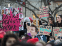 LONDON, ENGLAND - JANUARY 21: Protesters hold up placards as they gather in Trafalgar Square during the Women's March on January 21, 2017 in London, England. The Women's March originated in Washington DC but soon spread to be a global march calling on all concerned citizens to stand up for equality, diversity and inclusion and for women's rights to be recognised around the world as human rights. Global marches are now being held, on the same day, across seven continents. (Photo by Jack Taylor/Getty Images)