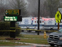 Deputies, federal agents and rescue personnel, converge on Great Mills High School, the scene of a shooting, Tuesday morning, March 20, 2018 in Great Mills, Md. (AP Photo/Alex Brandon )