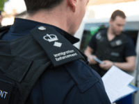 LONDON, UNITED KINGDOM - MAY 21: Immigration enforcement officers raid a home in Southall on May 21, 2015 in London, England. Despite pledging in 2010 to reduce migration numbers to less than 100,000, new immigration figures reveal that net migration to the UK reached 318,000 last year, the highest in a decade, increasing more than 50% in 2014. The Prime Minister has today unveiled measures to tackle illegal immigration, which include seizing wages. (Photo by Laura Lean - WPA Pool/Getty Images)