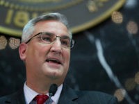 Indiana Gov. Eric Holcomb delivers his State of the State address to a joint session of the legislature at the Statehouse in Indianapolis, Tuesday, Jan. 9, 2018. (AP Photo/Michael Conroy)