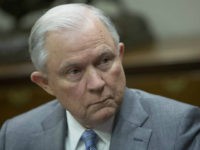 Jeff Sessions, U.S. attorney general, right, listens during a meeting with U.S. President Donald Trump, not pictured, and local and state officials on school safety at the White House in Washington, D.C., U.S., on Thursday, Feb. 22, 2018. Trump called for paying bonuses to teachers who carry guns in the classroom, embracing a controversial proposal to curb school shootings hours after offering a full-throated endorsement of the National Rifle Association. Photographer: Chris Kleponis/Pool via Bloomberg