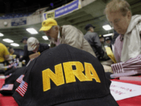 Illinois gun owners and supporters file out NRA applications while participating in an Illinois Gun Owners Lobby Day convention before marching to the Illinois State Capitol Wednesday, March 7, 2012 in Springfield, Ill. (AP Photo/Seth Perlman)