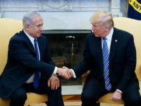 US President Donald Trump shakes hands with Israel's Prime Minister Benjamin Netanyahu in the Oval Office of the White House on March 5, 2018 in Washington, DC. President Donald Trump said he 'may' attend the opening of a controversial new US embassy in Jerusalem, a fraught prospect designed to underscore close ties with Benjamin Netanyahu, whom he hosted Monday.Trump warmly welcomed the embattled prime minister to the White House, claiming US-Israel ties had 'never been better' and floating a May trip that would be a major security and diplomatic challenge. / AFP PHOTO / MANDEL NGAN (Photo credit should read MANDEL NGAN/AFP/Getty Images)