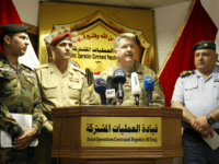 US Air Force Colonel John L. Dorrian (C), spokesman for Combined Joint Task Force - Operation Inherent Resolve, the US-led coalition fighting the Islamic State (IS) group in Iraq and Syria, speaks during a press conference in the capital Baghdad on April 11, 2017, accompanied by Brigadier General Yahya Rasool (L-2), spokesperson of the Iraqi Joint Operations Command coordinating anti-jihadist efforts, Brigadier General Saad Maan (L-1), spokesman for the Ministry of Interior and Baghdad operations, and Brigadier Tahseen Ibrahim (R), spokesman of the Ministry of Defense and Director of Media and Morale. IS now controls less than seven percent of Iraq, down from the 40 percent it held nearly three years ago, a military spokesman said on April 11, 2017. Iraqi forces backed by US-led air strikes and other support are now battling IS inside second city Mosul, after retaking much of the other territory the jihadists had seized. / AFP PHOTO / SABAH ARAR (Photo credit should read SABAH ARAR/AFP/Getty Images)