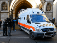 LONDON, ENGLAND - FEBRUARY 07: Members of the media look on as a prison van carries convicted rapist John Worboys from the High Court on February 7, 2018 in London, England. A judicial review hearing on March 13 will allow victims to challenge his planned release. (Photo by Leon Neal/Getty Images)