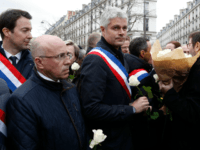 Politicians including LR MP Eric Ciotti (2L), LR president Laurent Wauquiez (C) and others prepare to take part in a slient march in Paris on March 28, 2018, in memory of Mireille Knoll, an 85-year-old Jewish woman murdered in her home in what police believe was an anti-Semitic attack. The partly burned body of Mireille Knoll, who escaped the mass deportation of Jews from Paris during World War II, was found in her small apartment in the east of the city on March 23, by firefighters called to extinguish a blaze. / AFP PHOTO / FRANCOIS GUILLOT (Photo credit should read FRANCOIS GUILLOT/AFP/Getty Images)