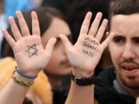 A visitor with with a Star of David and the words 'Against Hatred Toward Jews' written on her hands attends a rally against anti-Semitism on September 14, 2014 in Berlin, Germany. With the slogan 'Stand Up! Never Again Hatred Towards Jews' ('Steh auf! Nie wieder Judenhass'), the Central Council of Jews in Germany (Zentralrat der Juden) organized the demonstration after anti-Semitic incidents in the country occurring in the wake of the conflict in Gaza this summer, in which more than 2,000 Palestinians were killed by the Israeli government, the majority of whom were civilians, according to Palestinian authorities. (Photo by Adam Berry/Getty Images)
