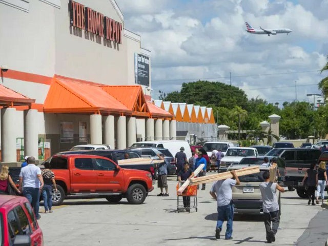 People leave with supplies outside a Home Depot store in Miami, Florida, as they prepare for Hurricane Irma, September 7, 2017. Miami orders people living in popular beach areas to evacuate as Hurricane Irma closes in, amid fuel shortages and traffic bottlenecks that threaten to complicate a mass exodus from the Sunshine State. / AFP PHOTO / SAUL LOEB (Photo credit should read SAUL LOEB/AFP/Getty Images)