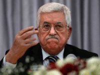 Palestinian President Mahmud Abbas gestures as he speaks during a Christmas lunch with members of the Christian Orthodox community on January 6, 2016 in the West Bank city of Bethlehem. Mahmud Abbas dismissed weeks of rumours the Palestinian Authority could collapse, saying he would 'never give up' on it. AFP PHOTO / THOMAS COEX / AFP / THOMAS COEX (Photo credit should read THOMAS COEX/AFP/Getty Images)