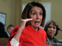 U.S. House Minority Leader Rep. Nancy Pelosi (D-CA) (2nd R) speaks as Rep. Michelle Lujan Grisham (D-NM) (R) listens during a meeting before the House Rules Committee about a bill to avert government shutdown December 21, 2017 at the Capitol in Washington, DC. Pelosi spoke on the Deferred Action for Childhood Arrivals (DACA) policy. (Photo by Alex Wong/Getty Images)