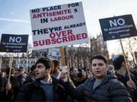 Protesters hold placards as they demonstrate in Parliament Square against anti-Semitism in the Labour Party on March 26, 2018 in London, England. The Board of Deputies of British Jews and the Jewish Leadership Council have drawn up a letter accusing Labour Leader Jeremy Corbyn of failing to address anti-Semitism in his party. Mr Corbyn has today apologised to Jewish groups for 'pockets of anti-Semitism' in Labour. (Photo by Jack Taylor/Getty Images)