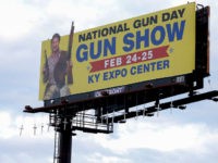 Seventeen crosses bearing the names and ages of those killed in last month’s shooting at Marjory Stoneman Douglas High School in Parkland, Fla., were hung overnight from a Louisville billboard that advertises a local gun show. A spokeswoman for billboard owner Outfront Media said Sunday, March 11, that the crosses would be removed.(Scott Utterback/Courier Journal via AP)