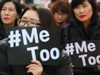 TOPSHOT - South Korean demonstrators hold banners during a rally to mark International Women's Day as part of the country's #MeToo movement in Seoul on March 8, 2018. The #MeToo movement has gradually gained ground in South Korea, which remains socially conservative and patriarchal in many respects despite its economic and technological advances. / AFP PHOTO / Jung Yeon-je (Photo credit should read JUNG YEON-JE/AFP/Getty Images)