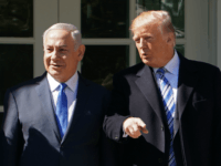 US President Donald Trump poses for a photo with Israel's Prime Minister Benjamin Netanyahu and in the Rose Garden of the White House on March 5, 2018 in Washington, DC. President Donald Trump said he 'may' attend the opening of a controversial new US embassy in Jerusalem, a fraught prospect designed to underscore close ties with Benjamin Netanyahu, whom he hosted Monday.Trump warmly welcomed the embattled prime minister to the White House, claiming US-Israel ties had 'never been better' and floating a May trip that would be a major security and diplomatic challenge. / AFP PHOTO / MANDEL NGAN (Photo credit should read MANDEL NGAN/AFP/Getty Images)