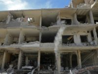 A partially destroyed building in Kfar Batna in the Syrian rebel enclave of Eastern Ghouta on March 1, 2018 following reported air strikes by Syrian government forces