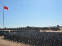 Chinese military helicopters fly in a formation to make the number "90" during a military parade in China's northern Inner Mongolia region in July, 2017; Beijing will spend 1.11 trillion yuan ($175 billion) on its military in 2018