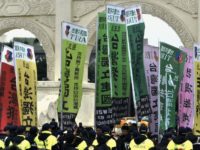 Pro-Taiwan indepedence activists hold banners on the 70th anniversary of the 