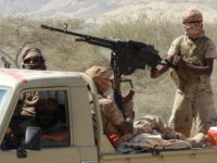 Yemeni fighters loyal to the government backed by the Saudi-led coalition ride in the back of a pickup truck during their the offensive in the Mesini Valley in the vast province of Hadramawt in February 2018