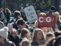 Students take part in a national walkout to protest gun violence after 17 people were shot dead at a Florida high school -- killings that have led President Donald Trump and his education secretary to call for arming teachers as a solution