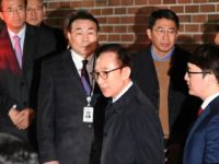 Former South Korean president Lee Myung-bak leaving his house for a police station where he was arrested