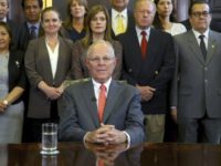 In this handout photo provided by the Peruvian Presidential Press Office, President Pedro Pablo Kuczynski poses with his cabinet before addressing the nation and announcing his resignation from office, Wednesday, March 21, 2018. The embattled Peruvian leader offered his resignation to Congress ahead of a scheduled vote on whether to impeach the former Wall Street investor, according to a presidential aide. (Juanca Guzman Negrini/Presidencia de Peru via AP)