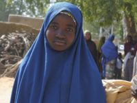 Aishat Alhaji , one of the kidnapped girls from the Government Girls Science and Technical College Dapchi who was freed, is photographed after her release, in Dapchi, Nigeria, Wednesday March. 21, 2018. Witnesses say Boko Haram militants have returned an unknown number of the 110 girls who were abducted from their Nigeria school a month ago. (AP Photo/Jossy Ola)