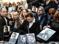 People hold portraits of Armenian intellectuals - who were detained and deported in 1915 - during a rally on Istiklal Avenue in Istanbul on April 24, 2018, held to commemorate the 103nd anniversary of the 1915 mass killing of Armenians in the Ottoman Empire. - Armenians say up to 1.5 million people were killed during World War I as the Ottoman Empire was falling apart, a claim supported by many other countries. Turkey fiercely rejects the genocide label, arguing that 300,000 to 500,000 Armenians and at least as many Turks died in civil strife when Armenians rose up against their Ottoman rulers and sided with invading Russian troops. (Photo by BULENT KILIC / AFP) (Photo credit should read BULENT KILIC/AFP/Getty Images)