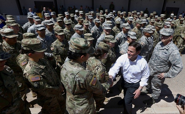 Arizona Governor Doug Ducey meets with his state's National Guardsmen who are being deployed to the border. (AP Photo: Ross D. Franklin)