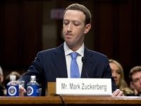 Facebook CEO Mark Zuckerberg pauses while testifying before a joint hearing of the Commerce and Judiciary Committees on Capitol Hill in Washington, Tuesday, April 10, 2018, about the use of Facebook data to target American voters in the 2016 election. (AP Photo/Andrew Harnik)