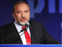 Israeli Prime Minister Benjamin Netanyahu and Former Israel Minister for Foreign Affairs Avigdor Liberman at his election campaign headquarters on Janurary 23, 2013 in Tel Aviv, Israel. Netanyahu was re-elected for a third term and will return to office, according to exit polls. Israel had the highest turnout of voters since 1999. (Photo by Lior Mizrahi /Getty Images)