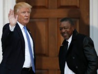 Donald-Trump-BET-founder-Robert-Johnson-11-20-16-ap FILE - In this Nov. 20, 2016 file photo, President-elect Donald Trump stands with BET founder Robert Johnson at the Trump National Golf Club Bedminster clubhouse in Bedminster, N.J.. Johnson is one of dozens of people who have paraded into Trump’s properties in New York and New Jersey in recent …