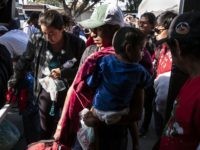 Central American migrants travelling in the "Migrant Via Crucis" caravan arrive at "Juventud 2000" shelter in Tijuana, Baja California state,Mexico, on April 24, 2018. - The annual caravan, whose numbers have dwindled to about 600 people since it started on the border with Guatemala on March 25, is nearing the US border. The activists leading it said they would help some 200 migrants request asylum in the United States because they are fleeing violence or repression. (Photo by GUILLERMO ARIAS / AFP) (Photo credit should read GUILLERMO ARIAS/AFP/Getty Images)