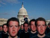 Life-sized cutouts depicting Facebook CEO Mark Zuckerberg wearing 