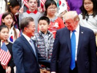 US President Donald Trump (R) and South Korea's President Moon Jae-in attend a welcoming ceremony at the presidential Blue House in Seoul on November 7, 2017. Trump's marathon Asia tour moves to South Korea, another key ally in the struggle with nuclear-armed North Korea, but one with deep reservations about the US president's strategy for dealing with the crisis. / AFP PHOTO / POOL / KIM HONG-JI (Photo credit should read KIM HONG-JI/AFP/Getty Images)