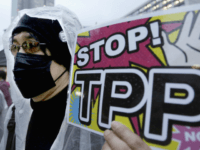 In this April 22, 2104 file photo, a protester holds a placard during a rally against the Trans-Pacific Partnership (TPP) in Tokyo. Donald Trump and Hillary Clinton agree on almost nothing. Except for their dislike of a sweeping agreement that would erase most tariffs and other trade barriers among the U.S. and 11 other nations. All the bashing from the presidential candidates has created more difficulties for the Trans-Pacific Partnership, one of President Barack Obamas top priorities in his final year in office. (AP Photo/Shizuo Kambayashi, File)