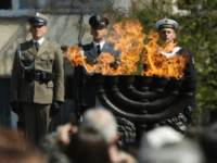 Polish soldiers attend the main commemoration ceremony of the 75th anniversary of the Warsaw Ghetto Uprising on April 19, 2018 in Warsaw, Poland. The Warsaw Ghetto was a prison created by the German military during its occupation of Warsaw during World War II. Starting in 1940, 400,000 Jews were confined to a walled-in neighborhood of 3.4 square kilometers under horrific conditions. With assistance from Polish partisans the Jews rose up in armed resistance in 1943 and held off the Germans for several weeks until the Germans annihilated the ghetto, killing 13,000 people. In all 392,000 Jews from the Warsaw ghetto were killed, most of them after deportation to the Treblinka death camp. (Photo by Sean Gallup/Getty Images)