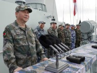 Chinese President Xi Jinping reviews a naval parade Thursday in the South China Sea.