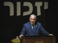 Israeli Prime Minister Benjamin Netanyahu speaks at the official ceremony for Israel's Memorial Day for fallen soldiers, at the National Memorial Hall for Israel's Fallen, in Mt. Herzl Military Cemetery, Jerusalem, Wednesday, April 18, 2018. (Debbie Hill/Pool via AP)