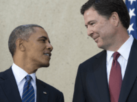 US President Barack Obama stands alongside new FBI Director James Comey (R) during an installation ceremony at Federal Bureau of Investigation Headquarters in Washington, DC, October 28, 2013. Comey replaces longtime FBI Director Robert Mueller, who recently retired after 12 years leading the organization. AFP PHOTO / Saul LOEB (Photo credit should read SAUL LOEB/AFP/Getty Images)